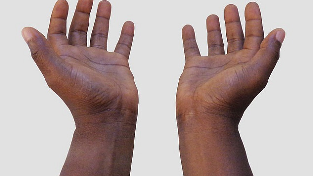 two hands opened out in a giving and/or receiving position
