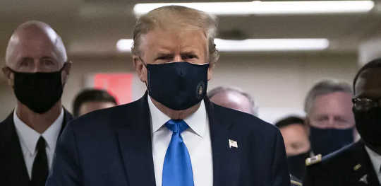 US President Donald Trump wears a mask as he visits Walter Reed National Military Medical Center in July 2020.  (what should you say to someone who refuses to wear a mask)
