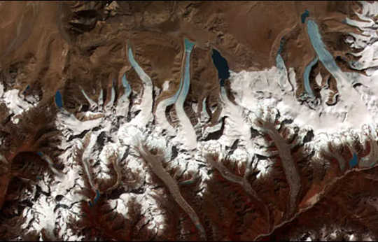 This ASTER image shows the lakes left behind by retreating glaciers in the Bhutan-Himalaya. (how ancient ice cores show black swan events in history even pandemics)
