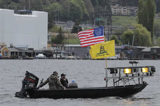 During an April protest in Seattle, a boat flies the Gadsden  (five reasons not to underestimate far right extremists)
