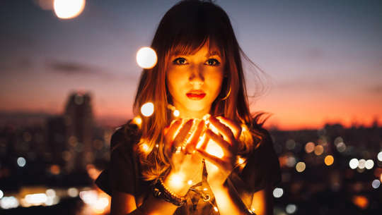 woman holding fireflies