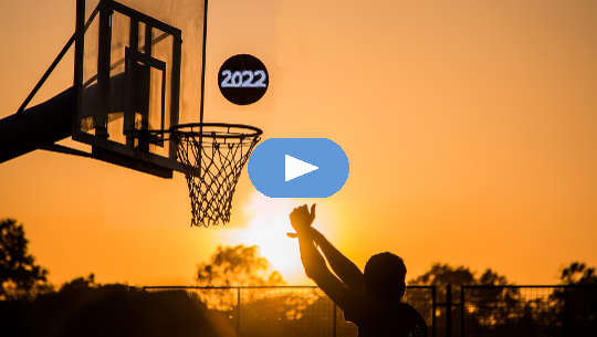 basketball playing shooting a 2022 ball into the hoop