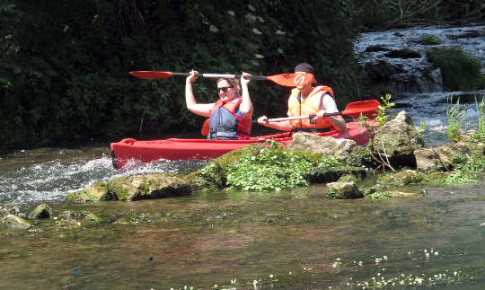 a man and woman in a kayak