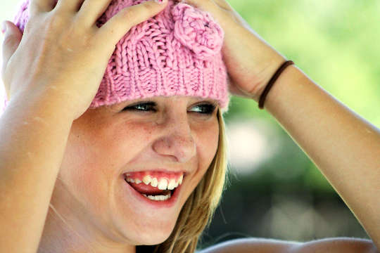 young woman with a very happy and joyful smile