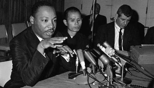 Martin Luther King Jr. speaks during a Chicago news conference with the Buddhist monk Thich Nhat Hanh