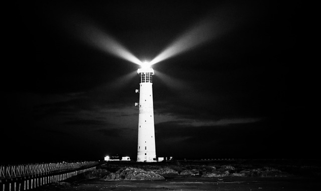 lighthouse sending a bright light in all directions