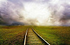 ligne de chemin de fer partant dans les nuages