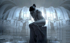 una statua di una donna nuda seduta su un piedistallo