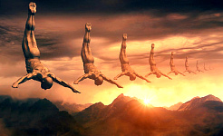 male figures in the sky diving in front of the sun