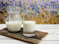 A pitcher and glass of milk. Image by congerdesign from Pixabay.