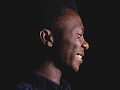 A smiling man with a peaceful look. Image by Quadri Joshua from Pixabay. 