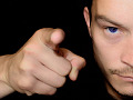 A man up close and pointing a finger at someone. Image by PublicDomainPictures from Pixabay. 