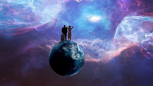 2 people standing on the globe of Planet Earth looking out into the Universe