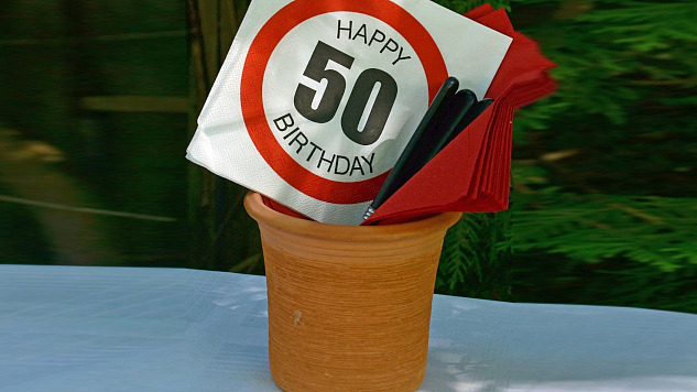 A sign in a garbage can that says Happy 50 Birthday. Image by Anemone123 from Pixabay. 