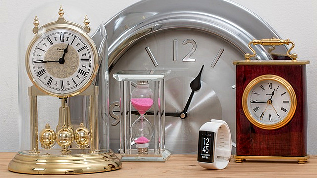 various clocks and watches all showing 15 minutes to 1