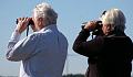an older couple with binoculars