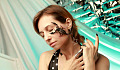 a scorpion on a woman's face, her eyes are closed