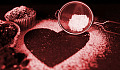 a sifter on top of the shape of a heart