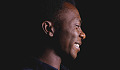 A smiling man with a peaceful look. Image by Quadri Joshua from Pixabay. 