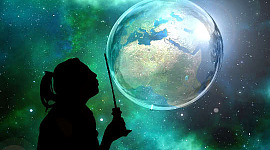 siluett av någon som håller en trollstav framför planeten jorden