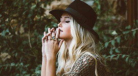 girl wearing a hat deep in thought