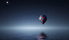luna plină peste un balon cu aer cald