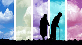 una coppia di anziani che cammina con i bastoni