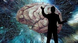 en silhuet af en mand, der står foran en kæmpe hjerne