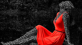 silhuett av en kvinne i en rød kjole med ord skrevet over hele huden hennes