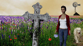 eine Frau an einem alten Grabstein mit einer Windmühle im Hintergrund