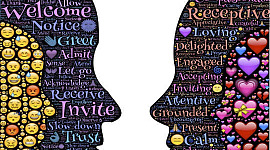 two faces in silhouette facing each other: one filled with a variety of emoticons, the other filled with love