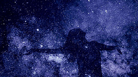 silhouette of a woman overlaid on a background of a starry galaxy