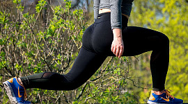 a waist down photo of someone doing a leg stretch