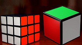 two rubik's cubes, one without separate pieces