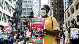 demonstranten in Toronto, Canada, steunen de rechten van migrerende werknemers