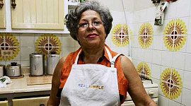 older person of color in 70s-style kitchen